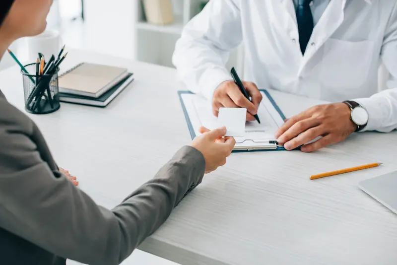 An advisor and a customer reviewing a policy