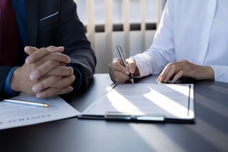 An underwriting review at a desk